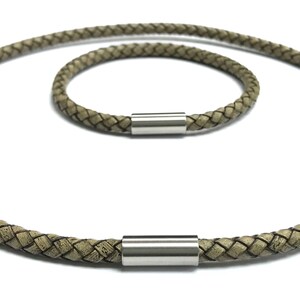 May include: Two braided leather necklaces with silver magnetic clasps. The necklaces are different lengths, one is longer than the other.