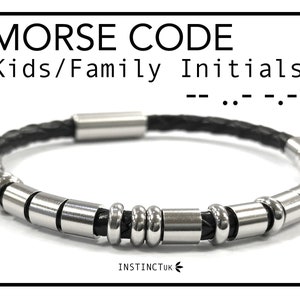 May include: Black leather bracelet with silver metal beads and a silver clasp. The bracelet has the text "MORSE CODE Kids/Family Initials" above it. The text "--...--" is below the bracelet.