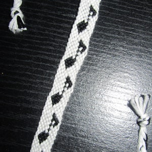 Brazilian bracelet black musical note white background