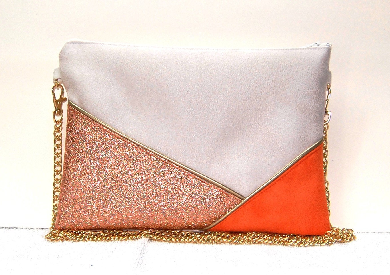 pink suede clutch bag