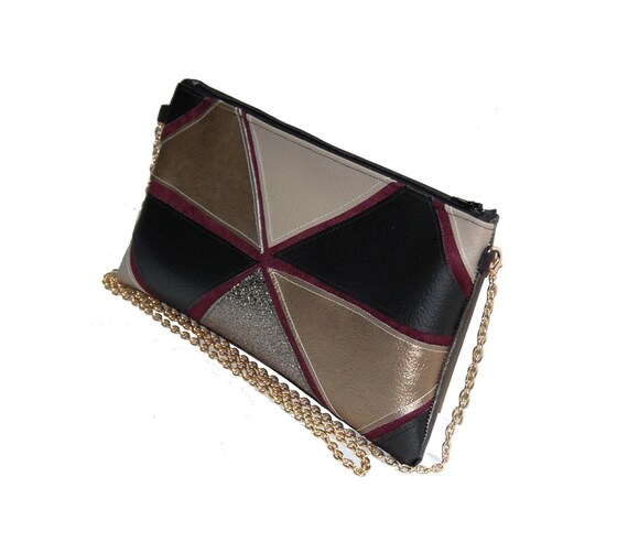 burgundy and gold clutch bag