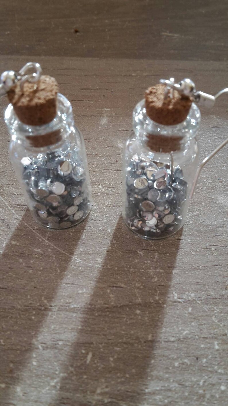 Flared earrings with silver rhinestones