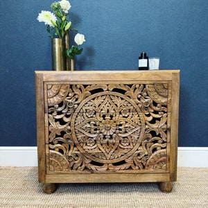 Hand carved chest of drawers made from mango wood