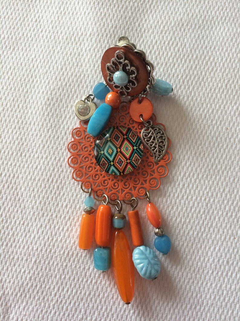 Very pretty fancy earrings clips of orange and light blue