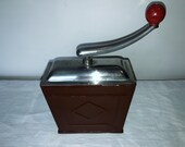 A metal coffee mill from Germany, manufactured by quot SWM Exact quot . Antique Coffee Grinder. Old Coffee Mill