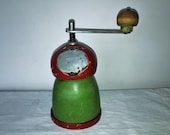 Cylindrical coffee mill with a Russian type of wood. Antique Coffee Grinder. Old Coffee Mill