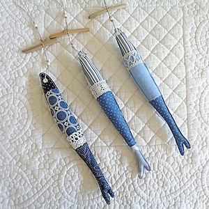 Large fabric fish, driftwood