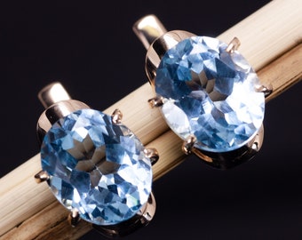 Solid gold Sky blue Topaz earring. 14k rose gold earrings.