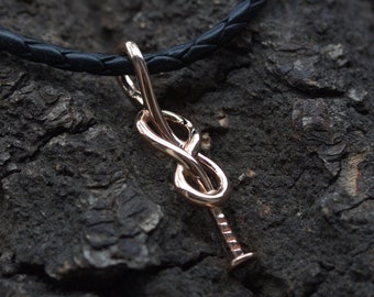 Solid gold knotted nail pendant. Solid gold pendant. Nail knot. Construction jewelry