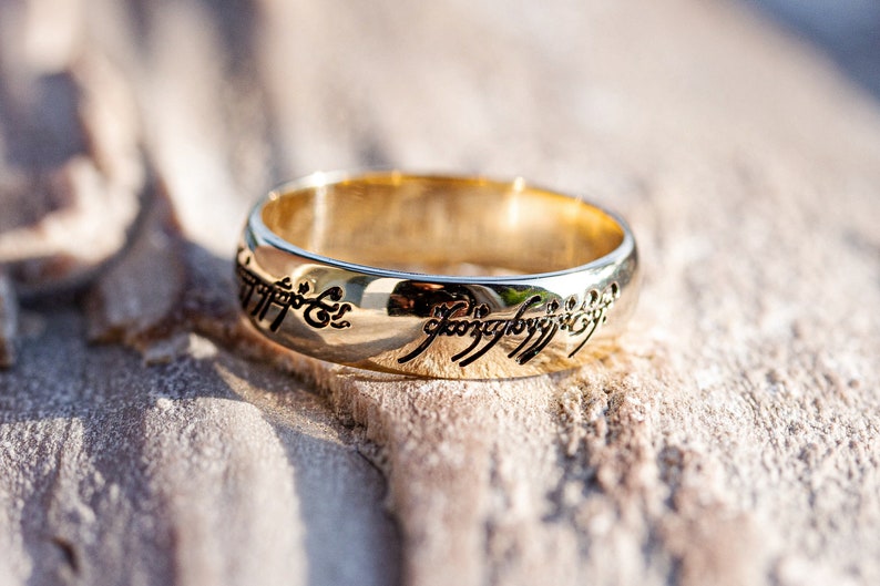 One ring. Solid gold 14K ring. Band ring with engraving. image 1