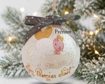 Personalized Christmas bauble for a girl's first Christmas, featuring a fairy, angel, and elf design in glass with a hand-painted illustration.