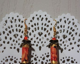 Pair of orange earrings