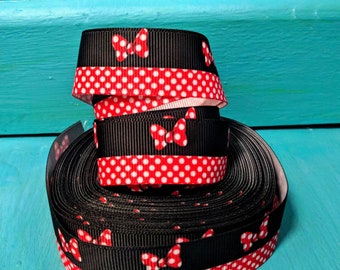 Ribbon with polka dots and red knot, big grain.