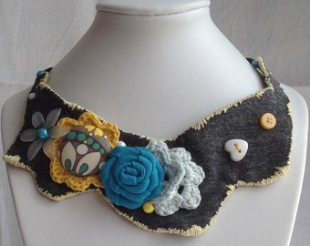 Fabric statement necklace " looks like spring" crocheted flowers on denim base.