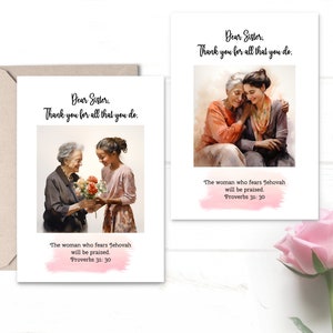 May include: A greeting card with a watercolor illustration of two women, one older and one younger, holding flowers. The card has the text "Dear Sister, Thank you for all that you do." and a quote from Proverbs 31:30, "The woman who fears Jehovah will be praised."