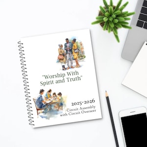May include: A spiral-bound notebook with the text "Worship With Spirit and Truth" and "2025-2026 Circuit Assembly with Circuit Overseer." The cover features watercolour illustrations of people. A pencil, a smartphone, and a small plant are also visible.