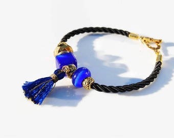 Bracelet chic bleu royal or, bracelet bleu cobalt doré, lumineux, élégant, perles oeil de chat, facettes cordon noir