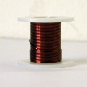 May include: A spool of copper wire wound around a white plastic bobbin. The wire is a deep reddish-brown colour.