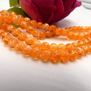 100 transparente Glasperlen - 6 mm gezogene Perle - Glasperle - Zugbank - orange durchscheinende Perle weiß gefädelt - Q325