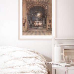 May include: A framed watercolor painting depicting a courtyard with an arched doorway, a fountain, and figures in the distance. The courtyard is decorated with intricate tilework and a lush garden.