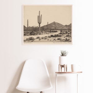 K&ouml;nnte beinhalten: Eine Schwarzwei&szlig;zeichnung mit Bleistift einer W&uuml;stenlandschaft mit hohen Kakteen und Bergen im Hintergrund. Die Zeichnung tr&auml;gt den Titel "Road to Paradise Valley, Arizona".