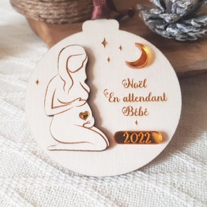 Christmas ball special pregnancy to personalize. Christmas suspension souvenir of pregnant woman in wood. Decoration for Christmas tree.
