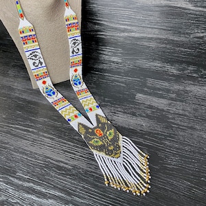 Ancient Egypt cat and scarab beadwork art necklace jewelry. Egyptian long tassel geometry necklace jewelry