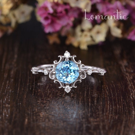 Blue topaz and 2024 diamond engagement ring