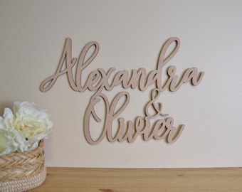 Sign two wooden first names to personalize to decorate an event or child's room