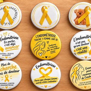 May include: A collection of nine round pin-back buttons featuring yellow awareness ribbons and French text related to endometriosis awareness. The designs include illustrations of a teddy bear, a woman's profile, and various heart motifs.