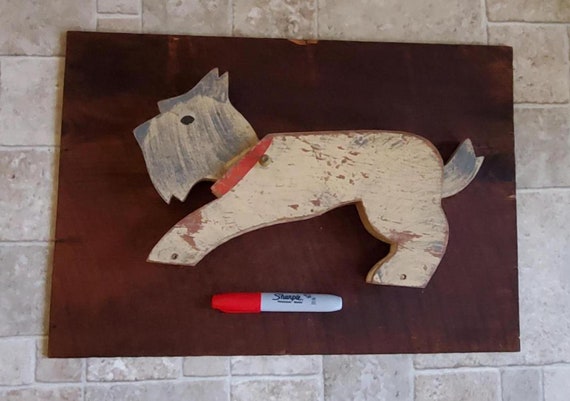 A handcrafted bobbing-head wooden terrier pull toy that looks like it escaped a 1940s nursery — kinetic, nostalgic, and genuinely artisan-made.