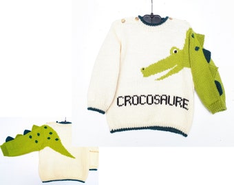 Pull bébé, layette bébé tricot main, en laine, avec un dinosaure