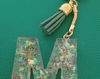 Resin key ring with green pompom charm and letter M