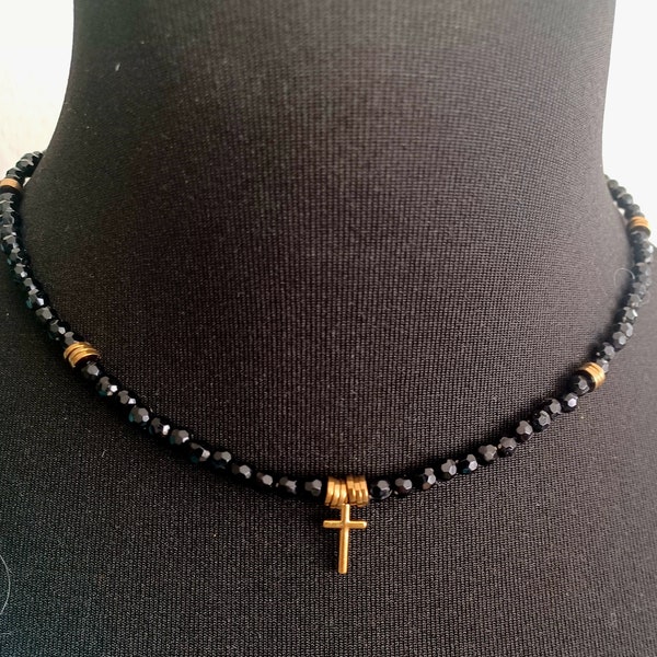 Choker with faceted black beads and golden cross charm