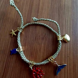 Bracelet with gold cord and enameled sea charms