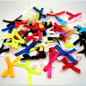 Mix of brightly colored polyester bows - width 0.3cm