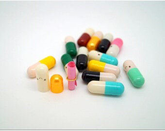 10 x Colored capsules/tablets for secret message