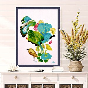 Print of my original water lilies painting featuring a nature scene with a heron wading bird and vibrant lotus plants against a white background. A long-beaked, golden-brown bird stands in ripples of water at the bottom left. Large, oversized lily pads in shades of bright green, teal, and turquoise dominate the center, detailed with delicate blue veins and scalloped dark edges. Soft pink and pale yellow lotus blossoms bloom on tall, slender stems. Signed "JeC" in script at the bottom right.
