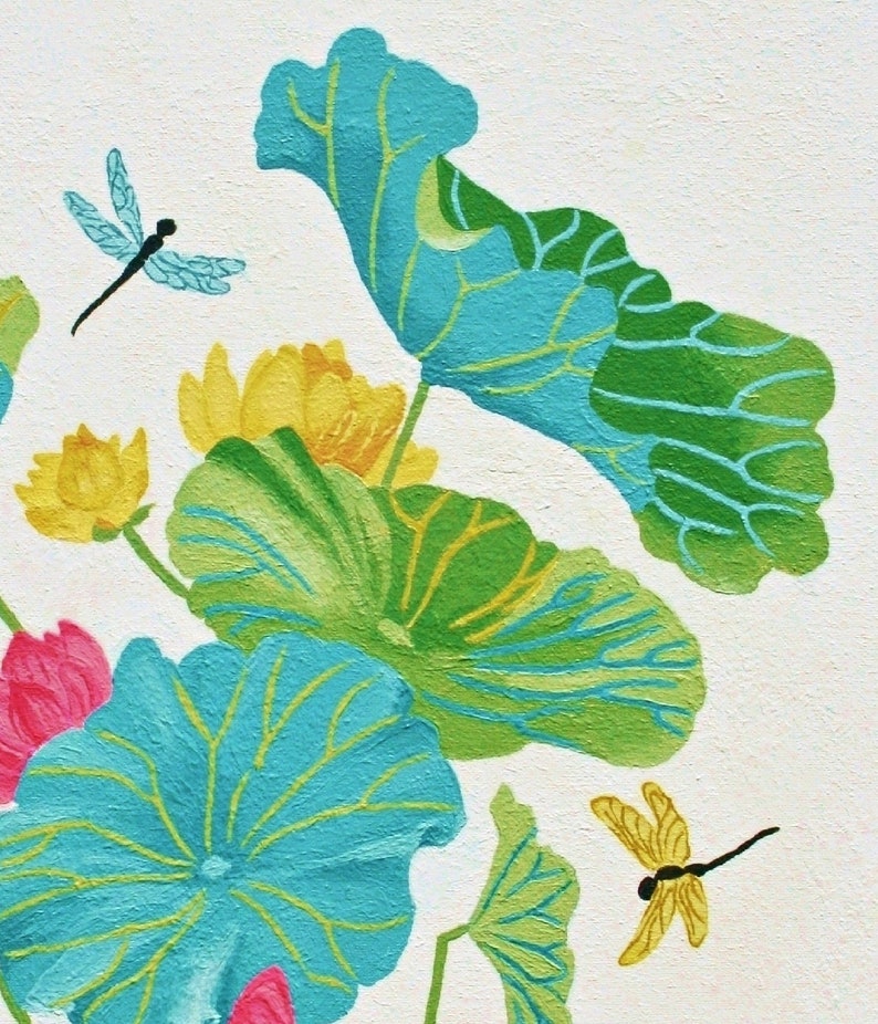 My painting of blue and green lotus leaves with yellow flowers and two dragonflies, one blue and one yellow, on a white background.