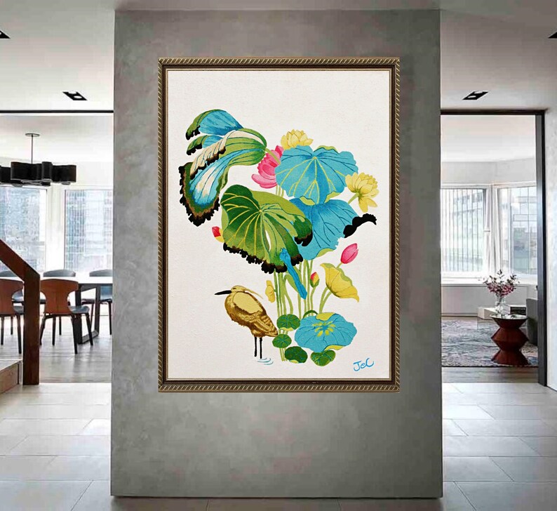 Print of my original water lilies painting featuring a nature scene with a golden wading bird and vibrant lotus plants against a white background. A long-beaked, golden-brown bird stands in ripples of water at the bottom left. Large, oversized lily pads in shades of bright green, teal, and turquoise dominate the center, detailed with delicate blue veins and scalloped dark edges. Soft pink and pale yellow lotus blossoms bloom on tall, slender stems. Signed "JeC" in script at the bottom right.