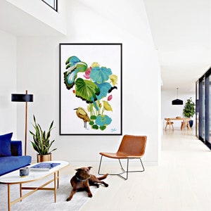 Print of my original water lilies painting featuring a nature scene with a golden wading bird and vibrant lotus plants against a white background. A long-beaked, golden-brown bird stands in ripples of water at the bottom left. Large, oversized lily pads in shades of bright green, teal, and turquoise dominate the center, detailed with delicate blue veins and scalloped dark edges. Soft pink and pale yellow lotus blossoms bloom on tall, slender stems. Signed "JeC" in script at the bottom right.