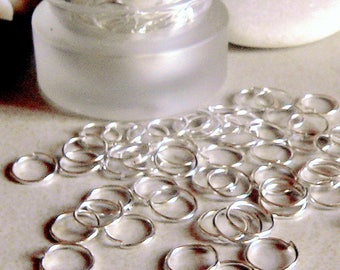 100 open rings in 8mm silver metal