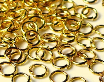 100 open rings in gold metal 8mm.0.9