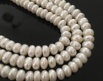 Boutons 9x6 perles  de culture nacrées d'eau douce  veritables blanches
