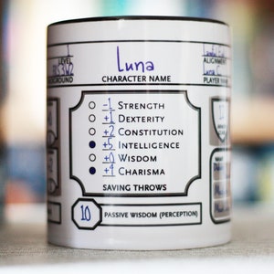 May include: White ceramic mug with a black rim and a black and white character sheet design. The character name is "Luna" and the character sheet includes stats for Strength, Dexterity, Constitution, Intelligence, Wisdom, and Charisma. The mug also includes a passive wisdom (perception) score of 10.