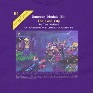 May include: A purple Dungeons & Dragons t-shirt with a vintage-style image of a dungeon module cover. The cover features a purple and gold design with the text "Dungeon Module B4 The Lost City by Tom Moldvay An Adventure for Character Levels 1-3".