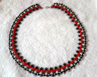 Needlework necklace with glass beads by Puca