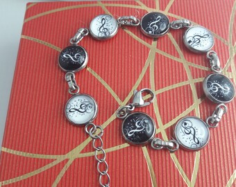 Bracelet en acier inox et cabochons en verre bombé