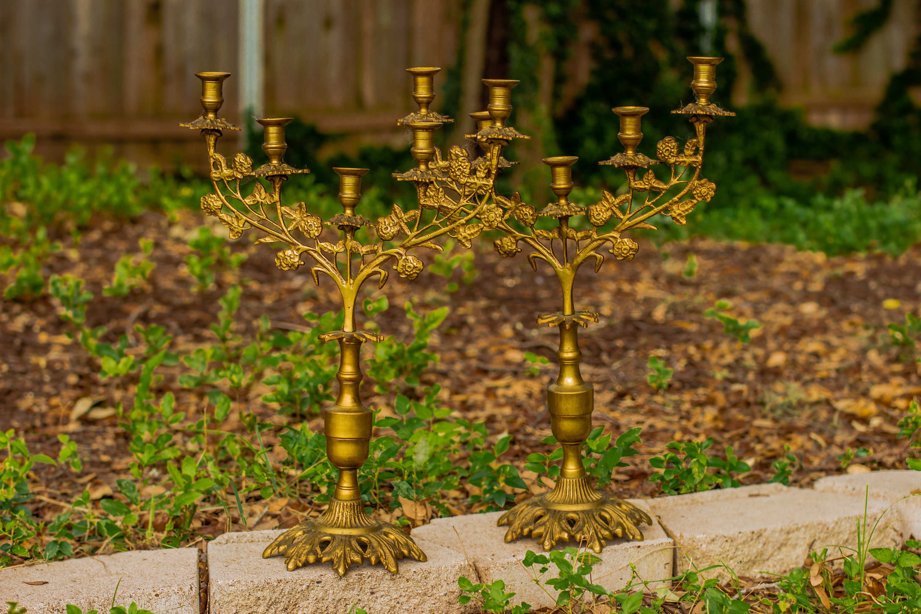 Beautiful antique candle holders in church Stock Photo by travnikovstudio