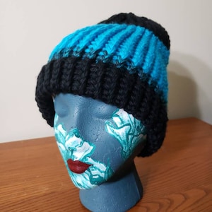 Blue and black soft slouchy beanie that is thick and will keep you warm during the winter!